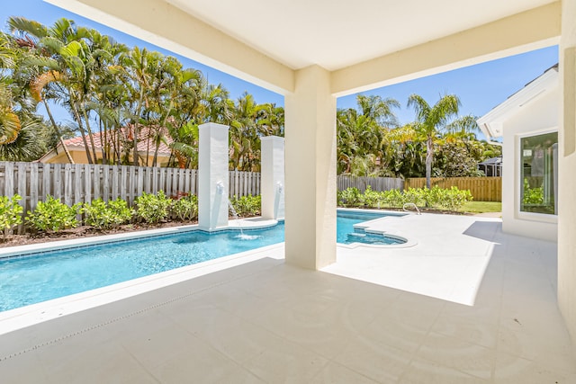 view of swimming pool with a patio