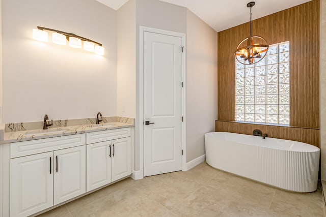 bathroom with wood walls, a bathing tub, vanity, tile patterned flooring, and a notable chandelier