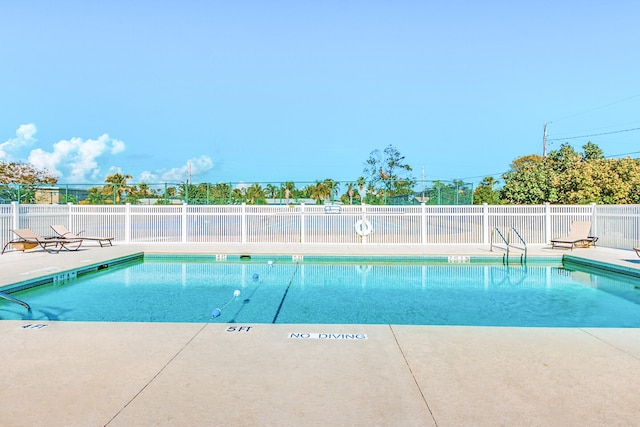 view of swimming pool featuring a patio