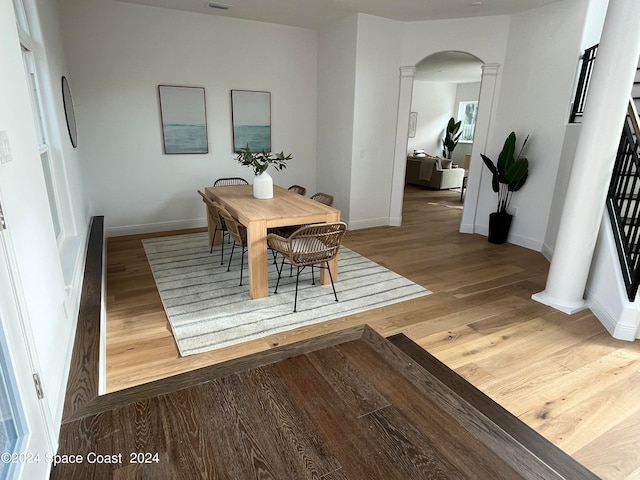 dining area with hardwood / wood-style flooring