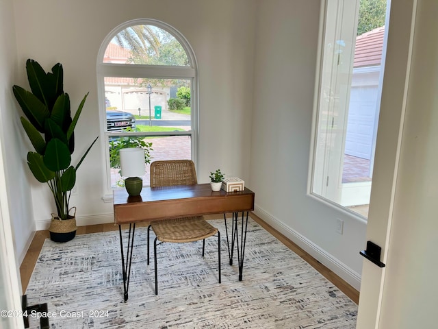 office space with light hardwood / wood-style floors