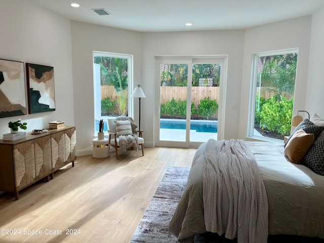 bedroom with light hardwood / wood-style flooring and access to exterior