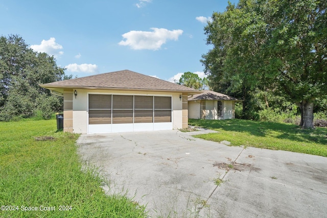 ranch-style house with a front lawn and a garage