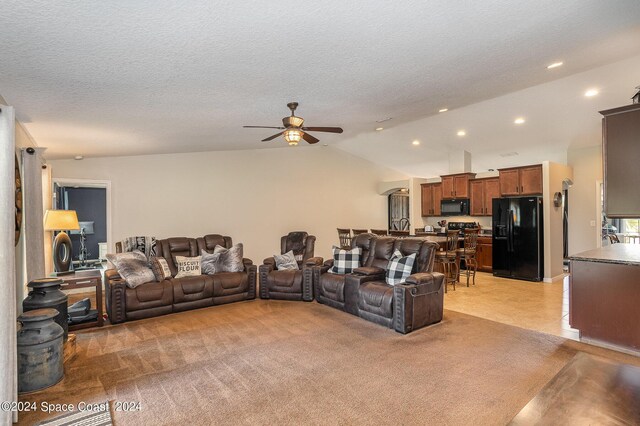 living room with light carpet, lofted ceiling, and ceiling fan