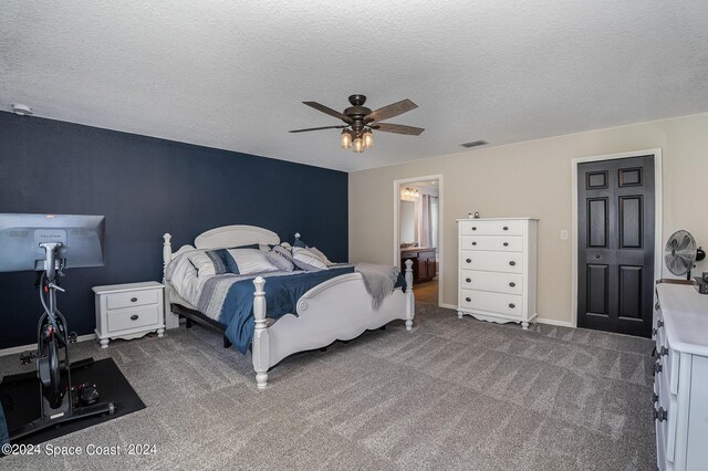 carpeted bedroom featuring a closet, ceiling fan, and a textured ceiling