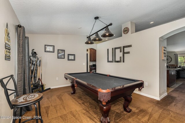 playroom with lofted ceiling, dark colored carpet, pool table, and a textured ceiling