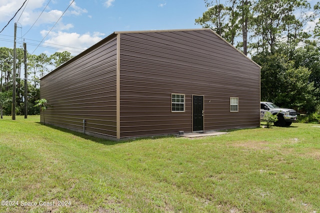 view of home's exterior with a yard