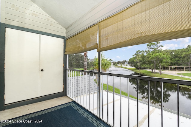 balcony featuring a water view