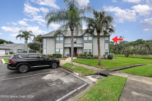 view of front of property with a front lawn