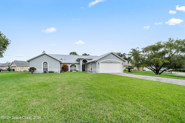 single story home with a front yard and a garage