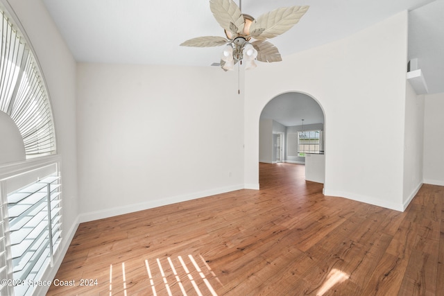 empty room featuring hardwood / wood-style floors and ceiling fan