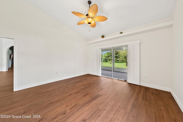 empty room featuring high vaulted ceiling, ceiling fan, and hardwood / wood-style flooring