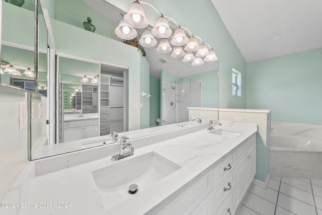 bathroom with separate shower and tub, vanity, vaulted ceiling, and tile patterned floors