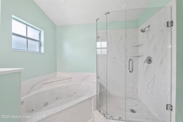 bathroom featuring separate shower and tub