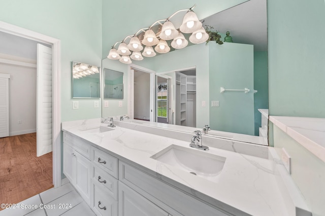 bathroom with vanity and hardwood / wood-style flooring