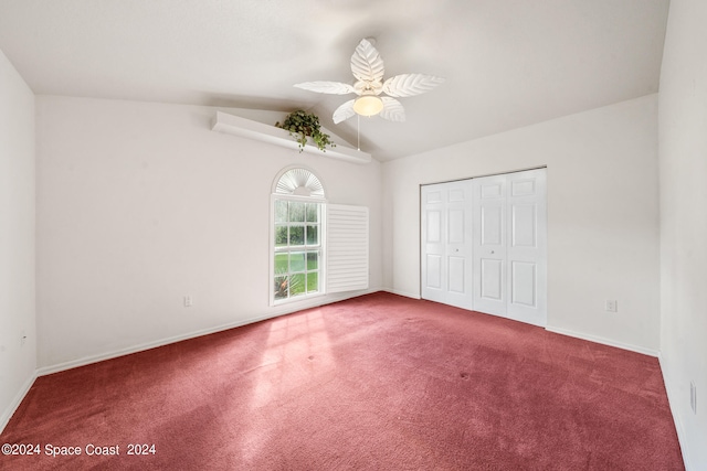 unfurnished bedroom featuring ceiling fan, a closet, and vaulted ceiling