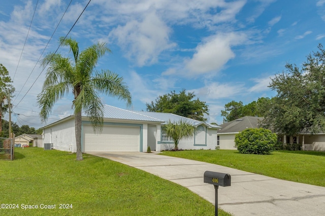 ranch-style home with a front yard, a garage, and central air condition unit