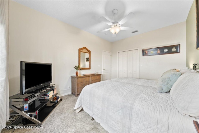 bedroom featuring a closet, ceiling fan, and carpet floors