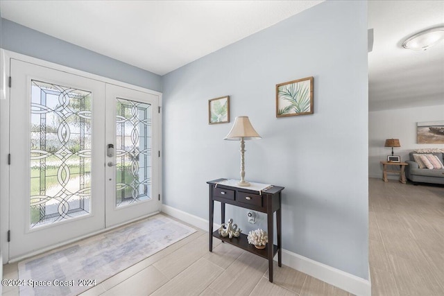 entrance foyer with plenty of natural light and french doors