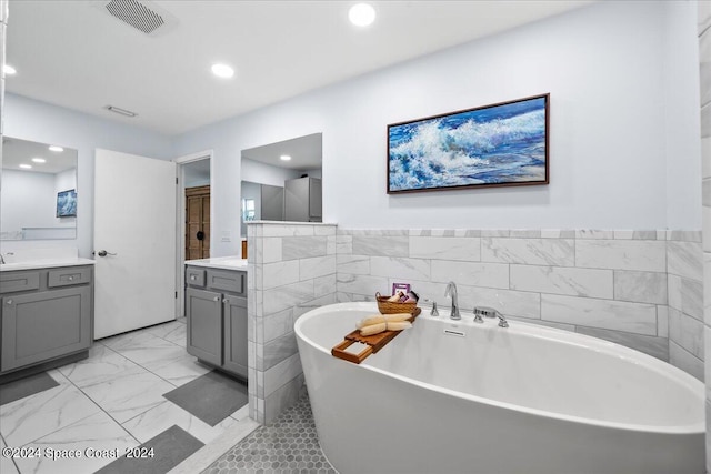 bathroom featuring vanity and a bathtub