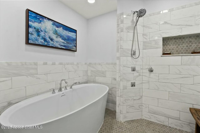 bathroom with tile patterned flooring, plus walk in shower, and tile walls