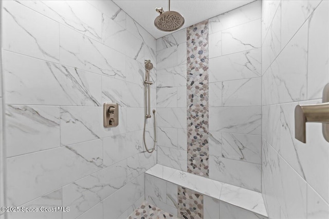 full bathroom with a tile shower