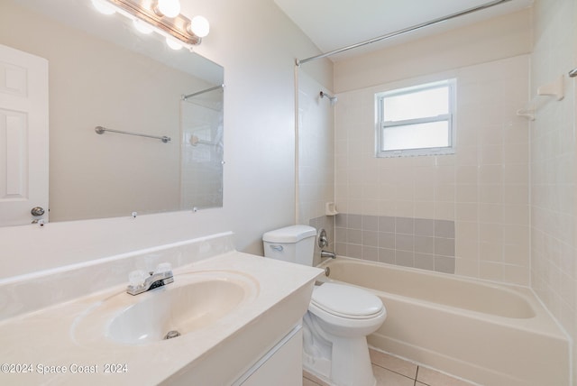 full bathroom with vanity, tiled shower / bath combo, toilet, and tile patterned flooring