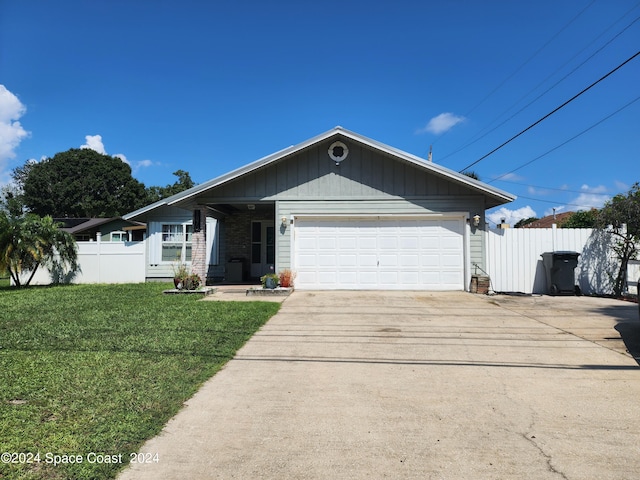 ranch-style house with a front yard and a garage