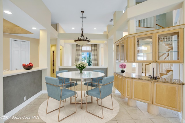 dining area featuring light tile patterned floors