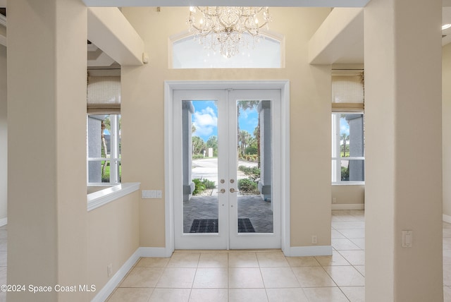 doorway featuring french doors, light tile patterned floors, and a wealth of natural light