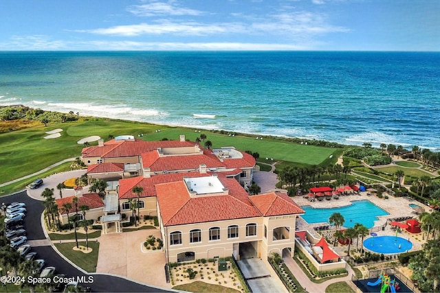 bird's eye view with a water view and a view of the beach