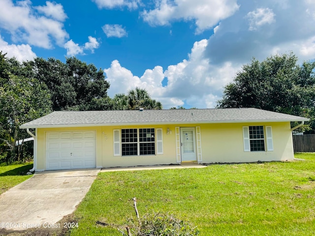 single story home featuring a front yard and a garage