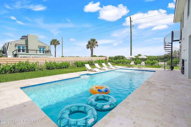 view of pool featuring a patio