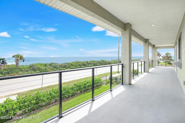 balcony featuring a water view