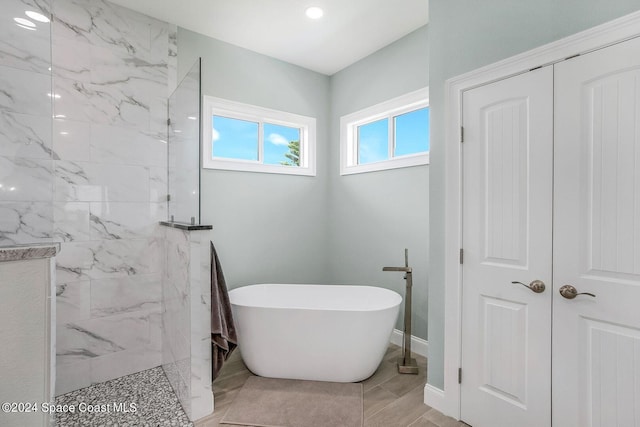 31 Seabridge Dr, Ormond Beach, FL 32176 - full bath featuring a freestanding tub and a marble finish shower