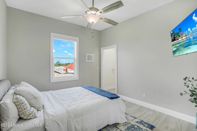 bedroom featuring light hardwood / wood-style floors and ceiling fan