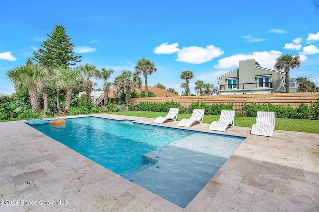 view of pool featuring a patio area