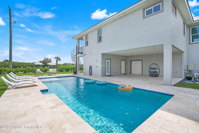 view of pool featuring a patio area