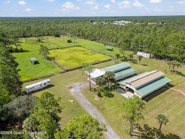 birds eye view of property with a rural view