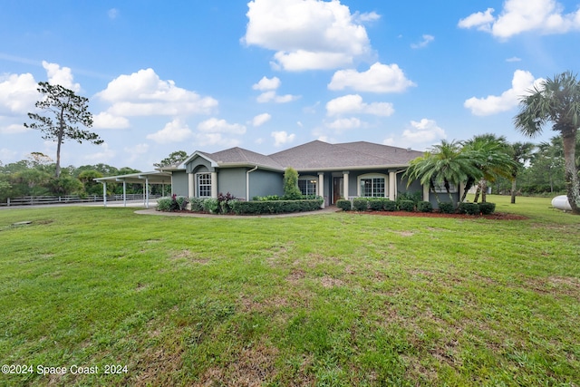 ranch-style home featuring a front lawn