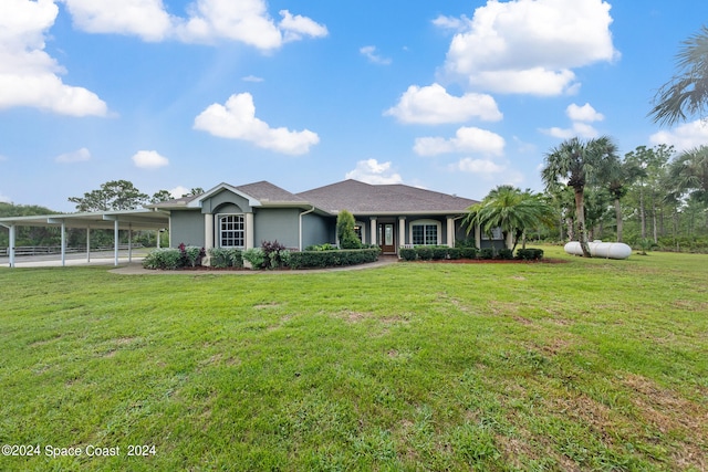 ranch-style home featuring a front yard