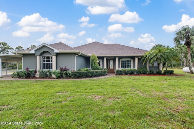 ranch-style house with a front yard and a carport