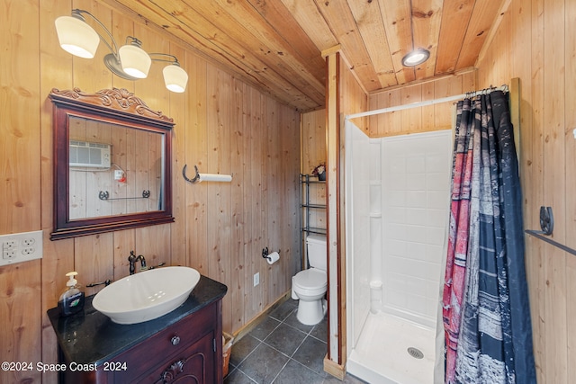 bathroom with toilet, wood walls, wooden ceiling, vanity, and curtained shower