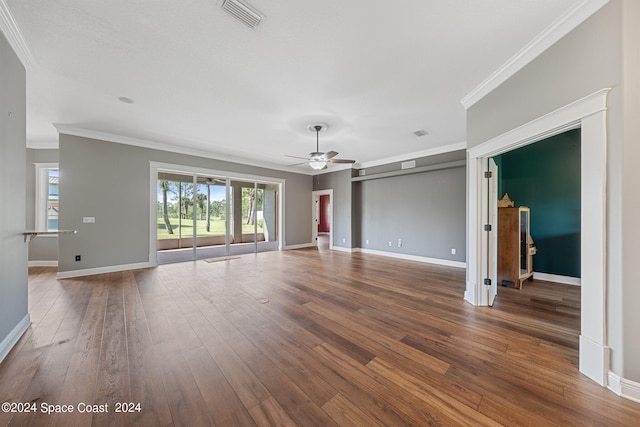 unfurnished living room with ceiling fan, crown molding, and wood-type flooring