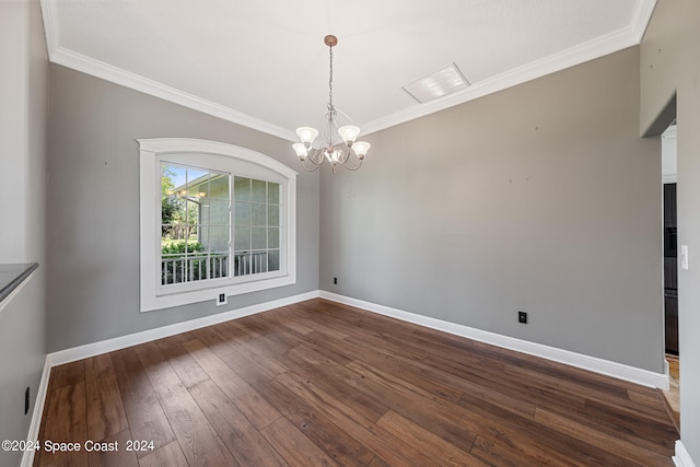 unfurnished dining area with ornamental molding, a chandelier, and dark hardwood / wood-style flooring