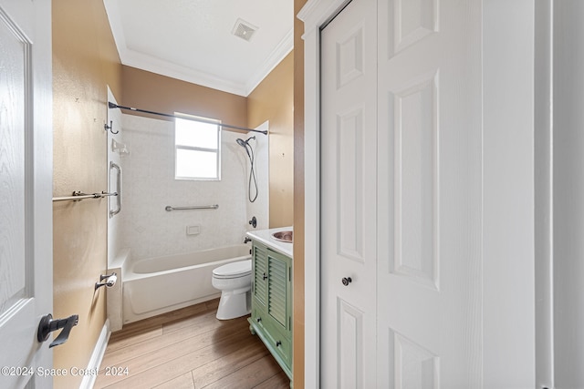 full bathroom with vanity, crown molding, hardwood / wood-style flooring, toilet, and  shower combination