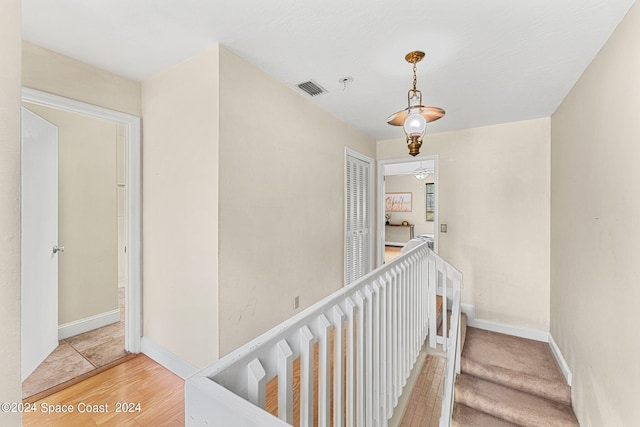 stairs with hardwood / wood-style floors