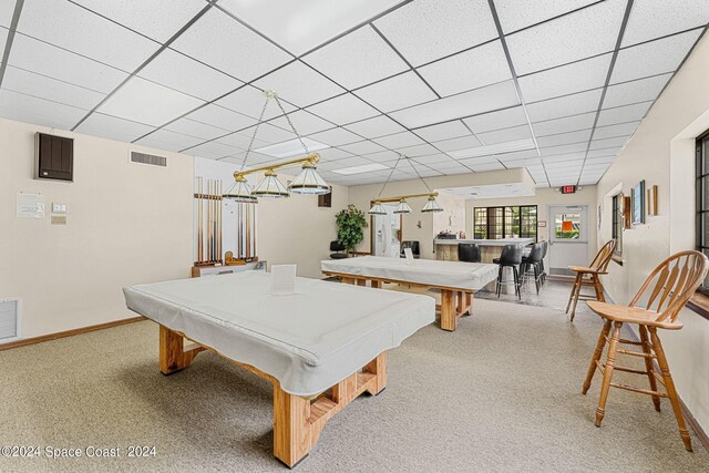 game room with pool table and light carpet