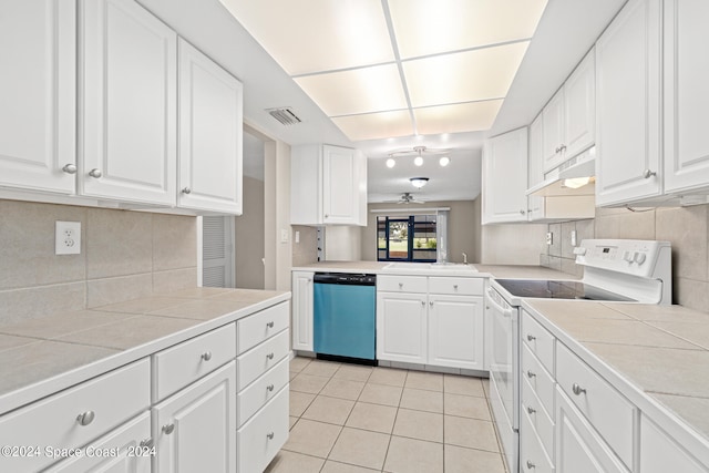 kitchen featuring decorative backsplash, white cabinetry, tile countertops, white range with electric stovetop, and stainless steel dishwasher