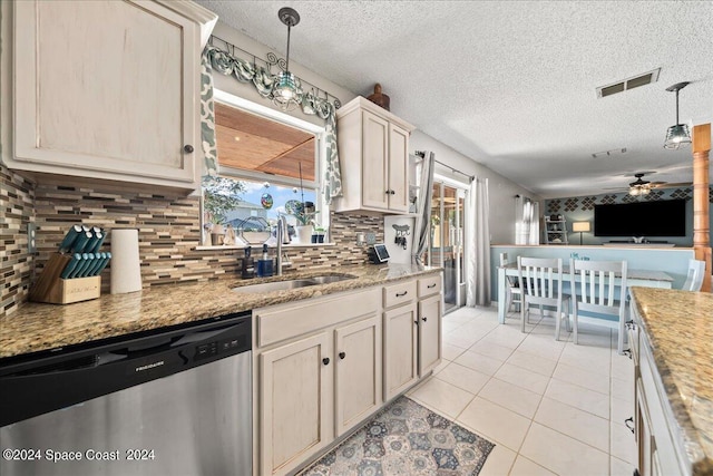 kitchen with tasteful backsplash, dishwasher, a textured ceiling, ceiling fan, and sink